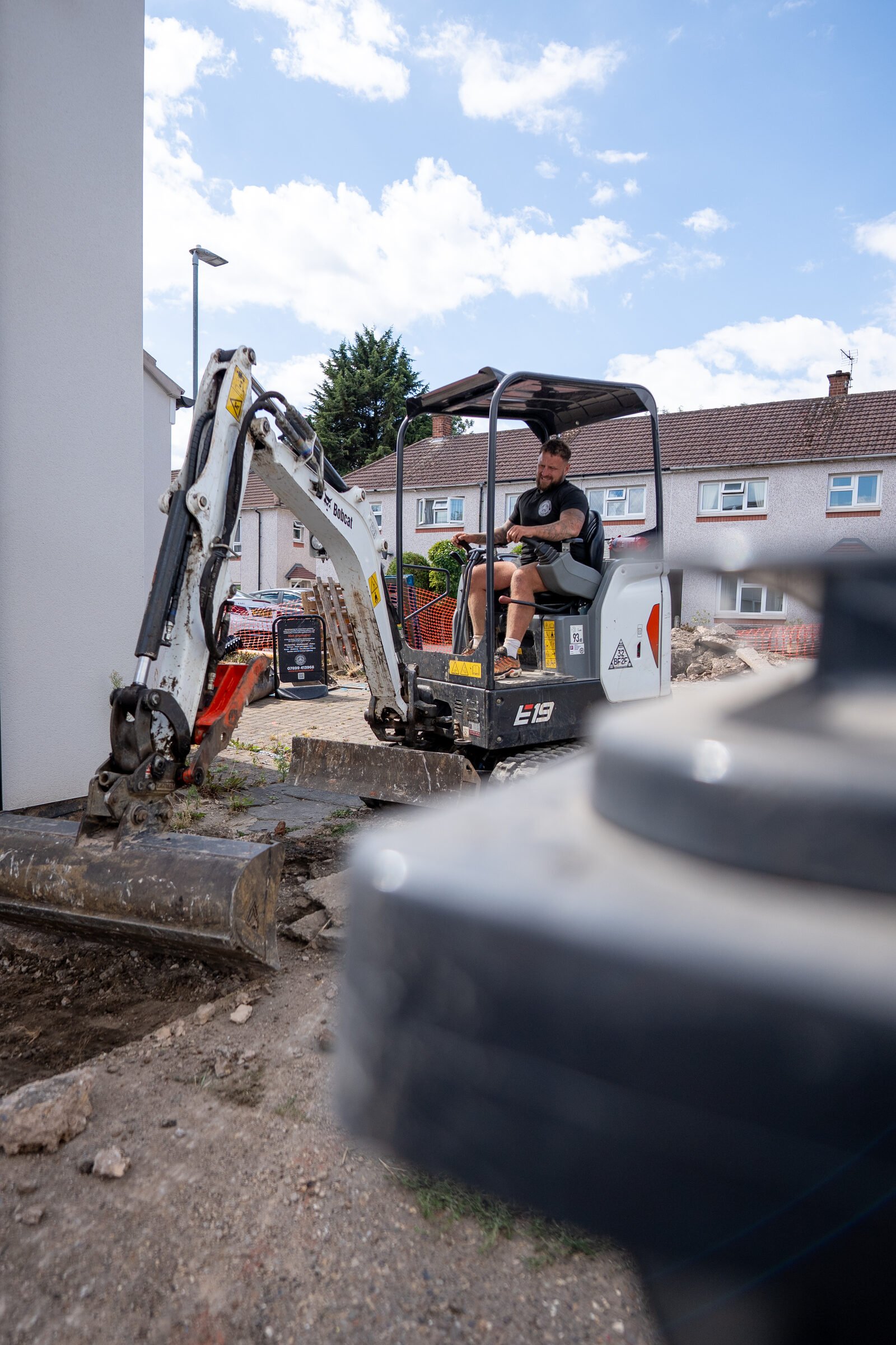 Mini excavator removing the existing driveway surface during Stamp Stone groundworks