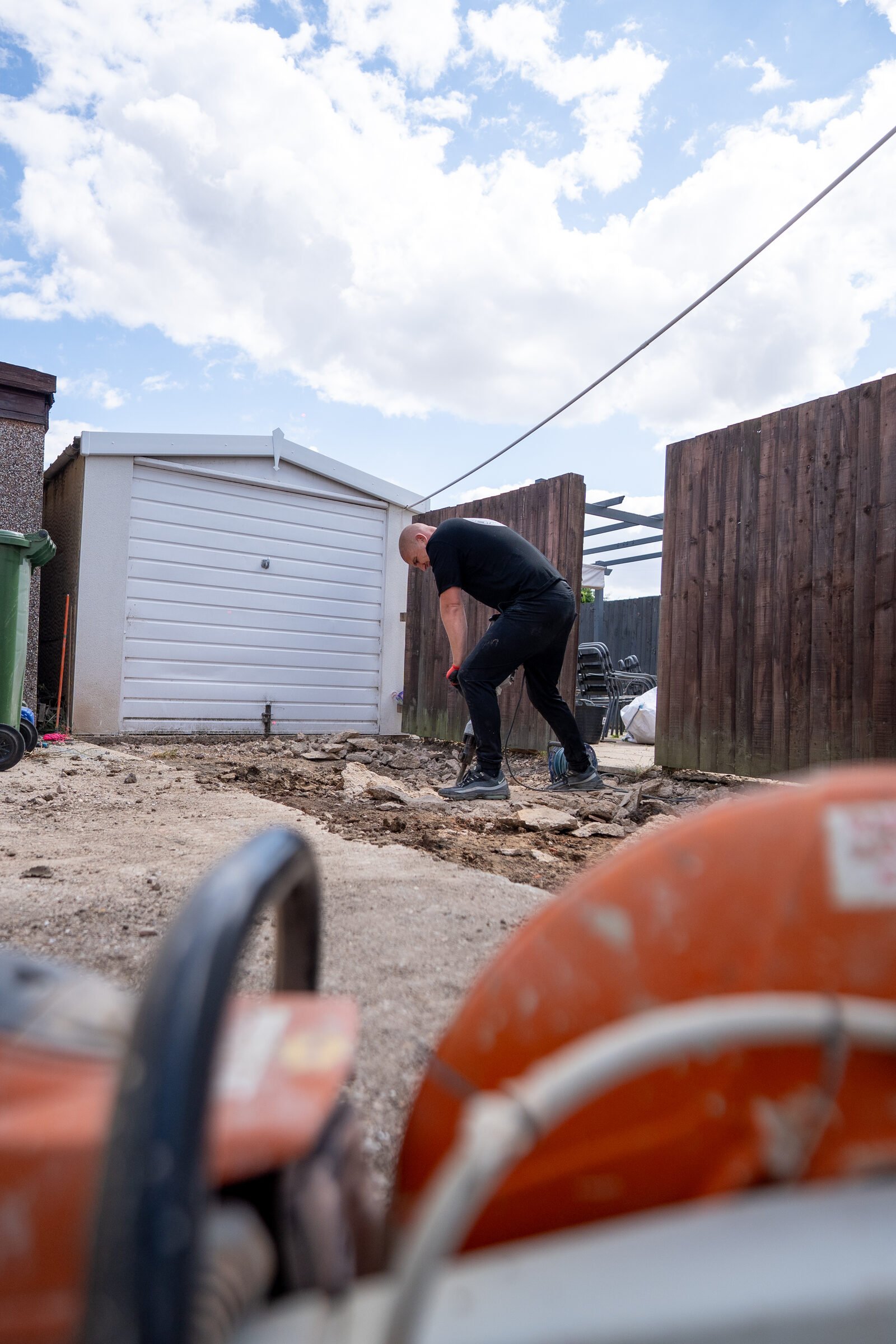 Groundworks preparation being completed by hand before the driveway installation